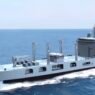 The image shows a rendering of a new fleet support ship being built for the Indian Navy.