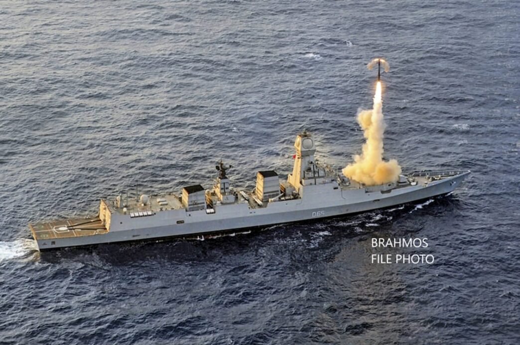 An Indian Navy warship is shown firing a BrahMos supersonic cruise missile.