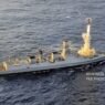 An Indian Navy warship is shown firing a BrahMos supersonic cruise missile.