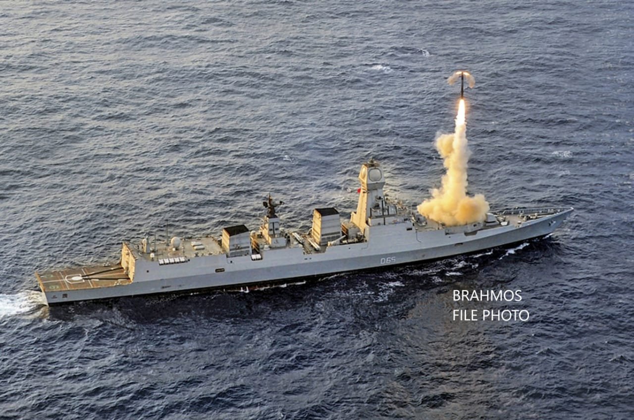 An Indian Navy warship is shown firing a BrahMos supersonic cruise missile.
